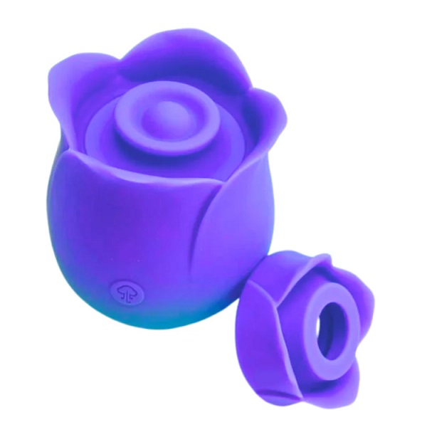 Purple silicone rose-shaped sex toy with removable cap on a white background.